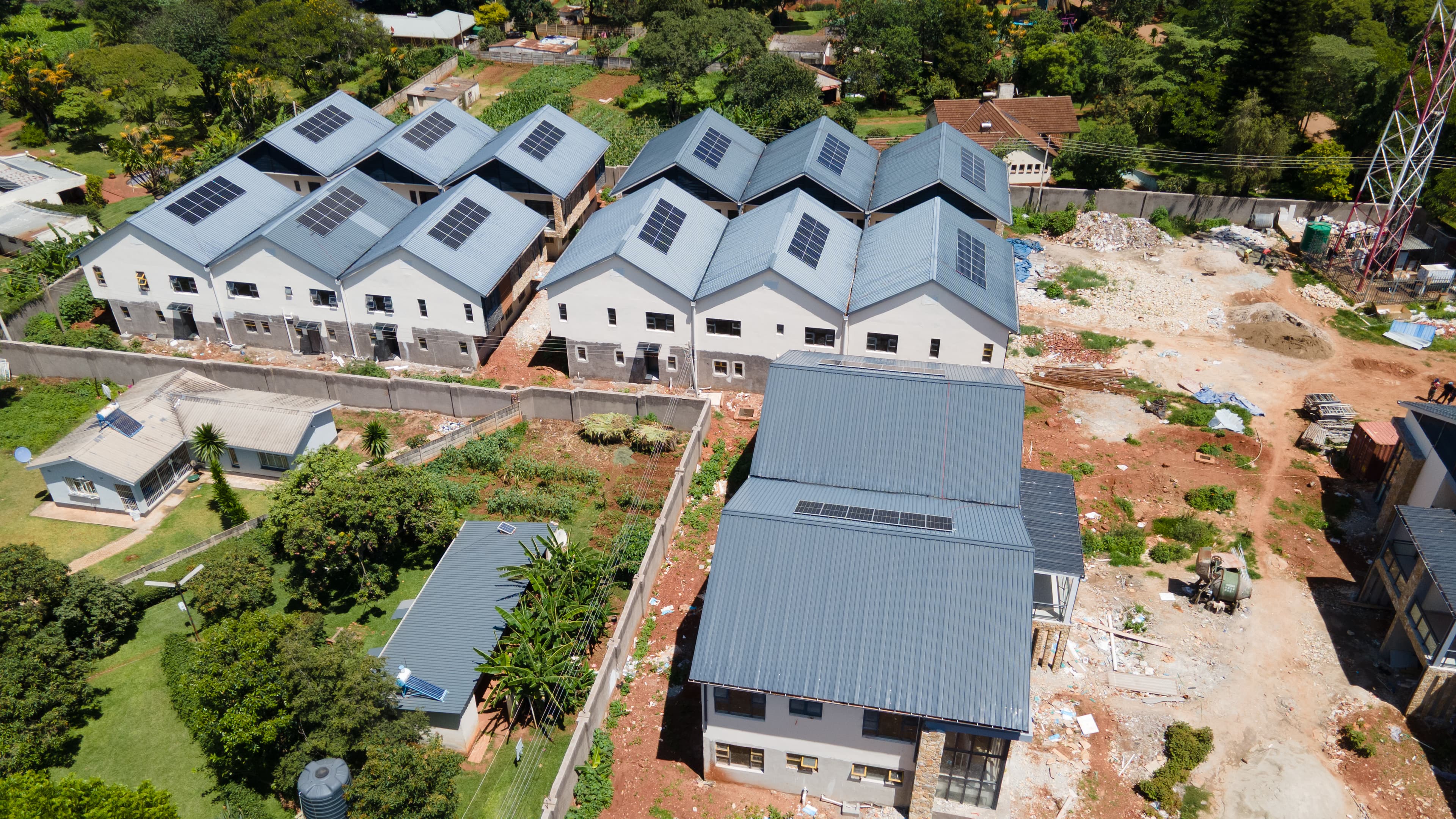 Wide aerial view of Prevail Properties campus at golden hour with warm light on the buildings
