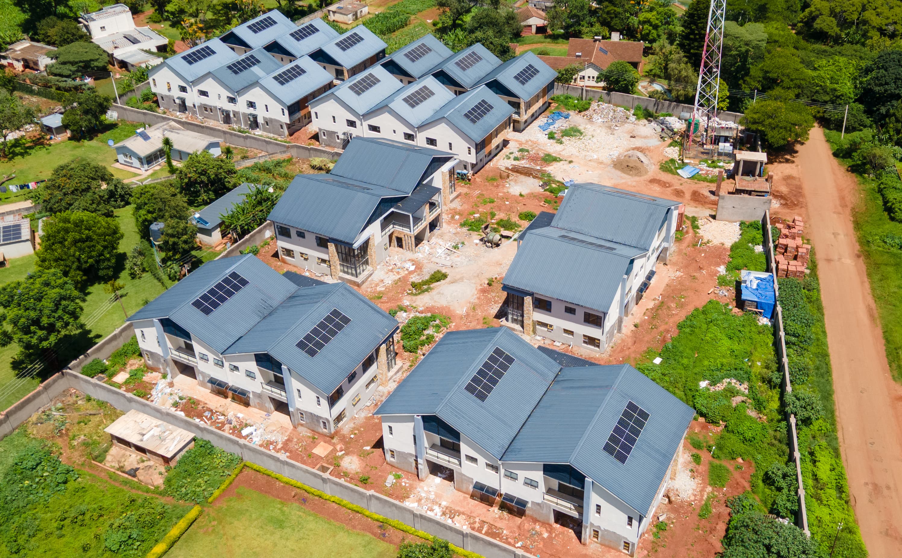 Aerial view of the complete Prevail Properties campus surrounded by mature trees and green spaces